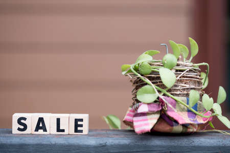 Wooden blocks with the word sale. Concept of sales and seasonal sales of goods and services. Discounts and promotions. Place for text.の写真素材