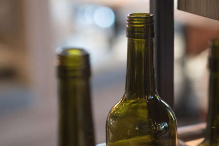Close up bottles of wine in a wine storeの写真素材