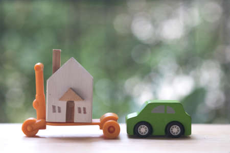 Miniature car and houses for dreaming everybody want to owner. Property or Assets for future planning stability can be exchanged for life. Saving or real estate investment conceptの写真素材