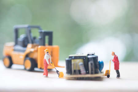 Miniature workers moving USB for repair. Concept of fixing electronic hardware and computer industry.の写真素材