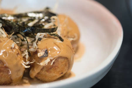 Takoyaki octopus that wrap with flour is delicious Japanese snackの写真素材