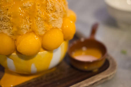 Korean shaved ice dessert with sweet toppings and fruitの写真素材