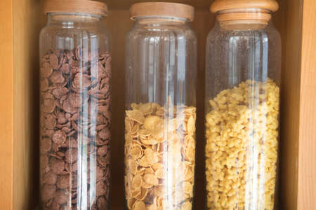 Variety of healthy corn flakes in glass ready for breakfastの写真素材