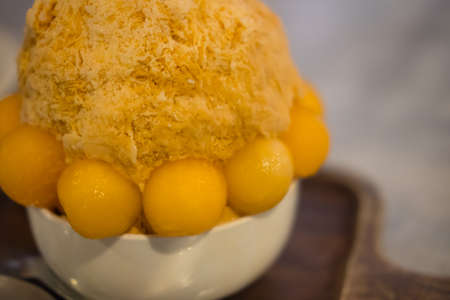 Thai Milk Tea shaved ice decoration with cantaloupe it called "Bingsu"の写真素材