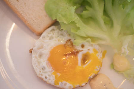 Homemade breakfast, egg toast and vegetable. Delicious homemade american breakfast conceptの写真素材