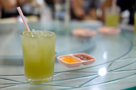 Sugar cane juice fresh in glass (selective focus). Sugarcane juice for healthy energy dietの写真素材
