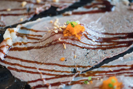 Sliced beef sushi with sauce and  fish roe - japanese food styleの写真素材