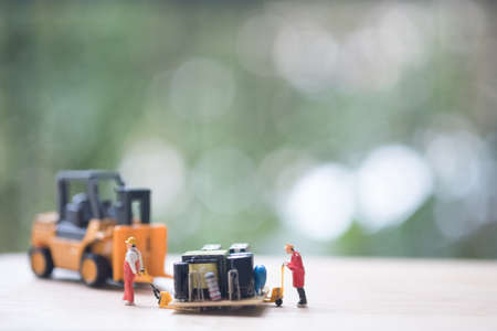 Miniature workers moving USB for repair. Concept of fixing electronic hardware and computer industry.の写真素材