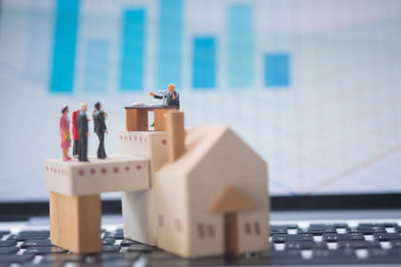 Miniature people: Business consultants on financial transactions for home loan. Image use for financial, business concept.の写真素材