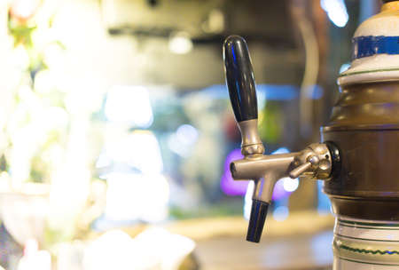 Close up of metallic beer taps in a barの写真素材