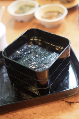 Customers leave dirty black tray and dirty tables in Shabu restaurantの写真素材