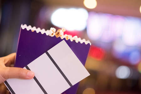 Two tickets and popcorn for going to the movies, concept of leisureの写真素材