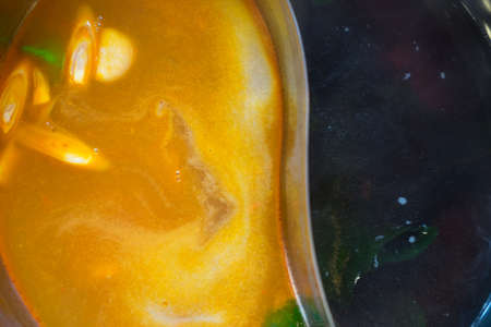 Double flavor hot pot in hot pot buffet (black and spicy tom yum soup)