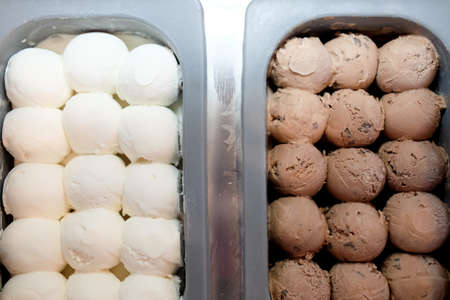 Close up of delicious scoops of coconut and chocolate ice cream. Summer concept.