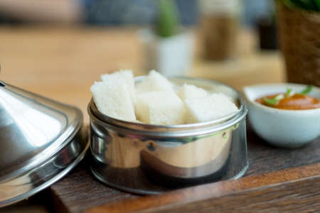 Bread with Thai tea custard delicious on wood table