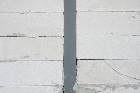 Construction renovation exterior walls and installing stone with mortar