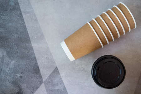 Top view stock brown paper coffee to go cup, copy space, brown backgroundの写真素材