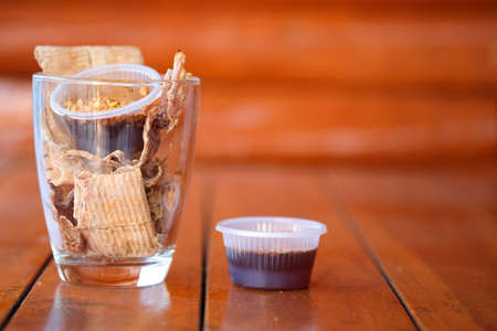 Thai food dried squid grilled grinding served with spicy sauce sprinkled with peanuts. Thai styleの写真素材