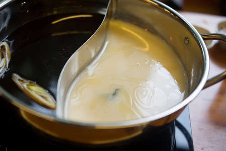 Double flavor hot pot in hot pot buffet (black and white soup)