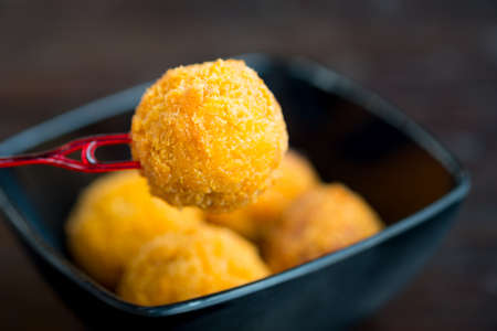 Breaded mozzarella cheese balls , close up