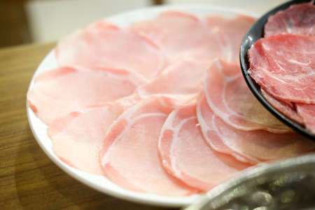 Raw red beef and raw pork slice for Shabu and Sukiyaki Japanese style. Can use to create menu in the restaurant.の写真素材