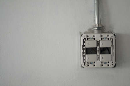 New lighting electrical modern light switch on a renovation wall,