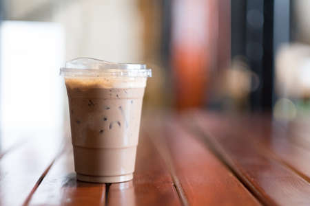 Iced mocha coffee with on wooden table in coffee shop