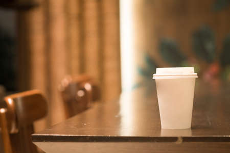 Paper cup of coffee take away at cafe shop. Concept for mockup