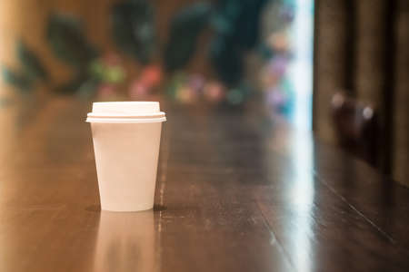 Paper cup of coffee take away at cafe shop. Concept for mockupの写真素材