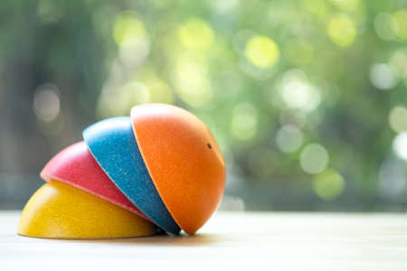 Empty stock of multicolored bowl on wood table