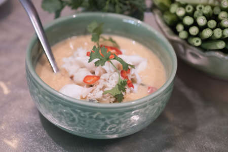 Soya bean dipping sauce with crab in coconut milk original Thai food. Served with fresh vegetables.の写真素材