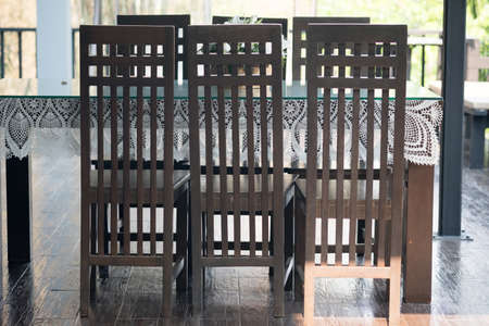 Set of table and chairs made of wood at restaurant in rustic style