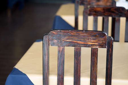 Detail of chairs made of wood at restaurant in rustic styleの写真素材