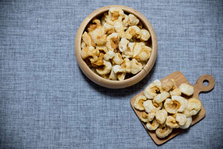 Crispy deep fried pork skin or pork rind, appetizer in Thailandの写真素材