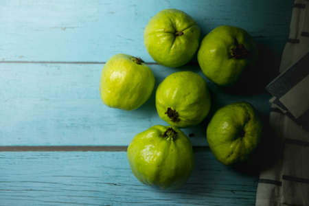 Guava (Psidium guajava Linn) fruit with bright green bark and white pulp, sweet, crispyの写真素材