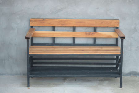 Waiting wood bench with loft cement wallの写真素材