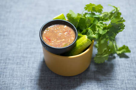 Spicy shrimp paste chilli sauce served with fresh cucumber and coriander, Thai style food
