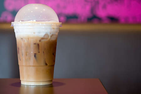 Ice cappuccino coffee in plastic glass ready for drink in the coffee shop