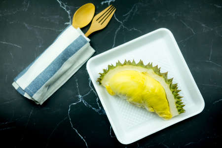 Durians peeled and yellow on the white foam box.の写真素材