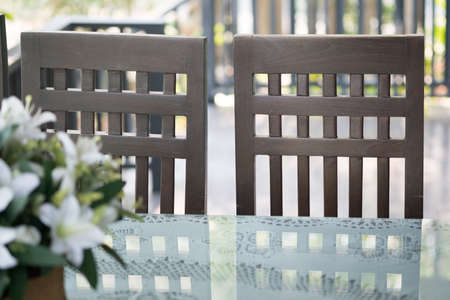 Detail of chairs made of wood at restaurant in rustic style