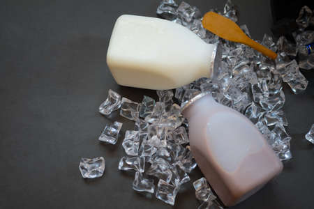 Flavor of milk in plastic bottles served with ice cubes (fresh milk and chocolate flavor)の写真素材