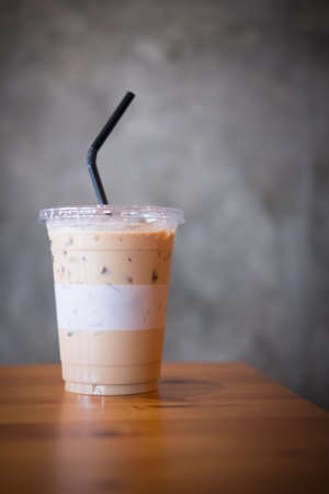 Ice latte coffee in glass on table, refresh beverageの写真素材