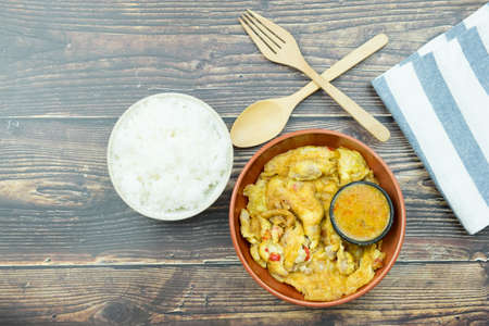 Omelet with spicy chilli sauce served with steamed riceの写真素材