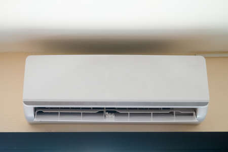 Air conditioner on wall sets a new air conditioner in homeの写真素材