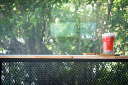 Strawberry smoothie or cocktail in a glass on the tableの写真素材