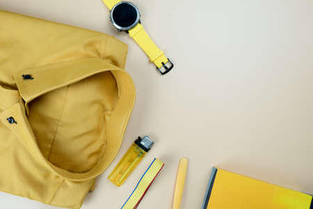 Set of yellow accessories outfits for men on yellow background. Trendy fashion male flat lay backgroundの写真素材