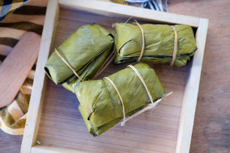 Close up steamed bananas sticky rice with Banana leaf wrap