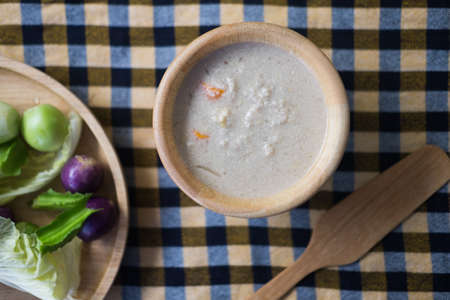 Pickled fish with minced pork in coconut milk served with fresh vegetables, Thai food diet menuの写真素材