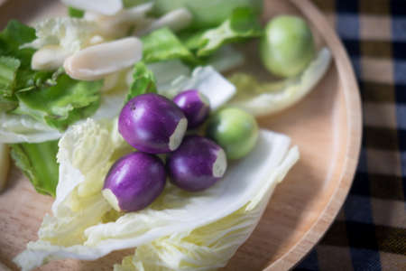 Set of Thai fresh vegetable for eat with Thai food on wood dish. Concept of healthy eatingの写真素材