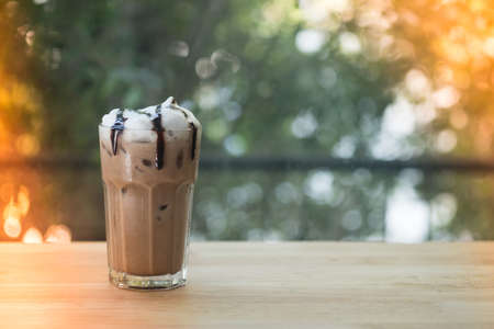Iced coffee mocha with milk foam. Selective focus.